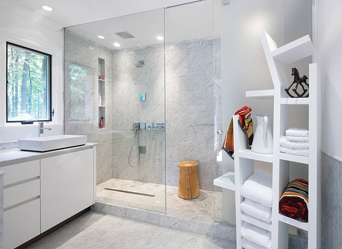 White Vanity Cabinet And Wall Sconces With Sliding Shower Doors Also Tile Floorings