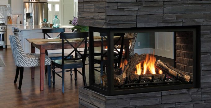 Stacked Stone Fireplace Surround With Zero Clearance Wood Burning Fireplace And Dining Set